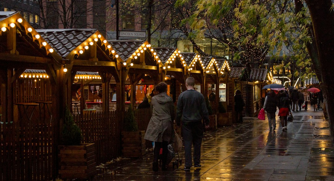 Festive Christmas market stalls and seasonal lights; illustrative image, not a photograph of Windsor